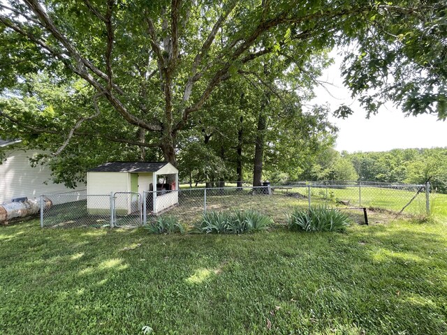 314 Birdsong Dr, Cadiz, KY 42211 - fenced backyard with an outbuilding