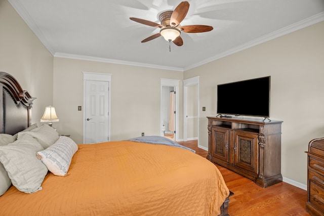 bedroom featuring ceiling fan, light hardwood / wood-style floors, and ornamental molding