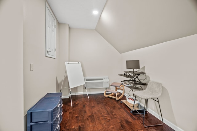 misc room with lofted ceiling, baseboards, wood finished floors, and a wall mounted air conditioner