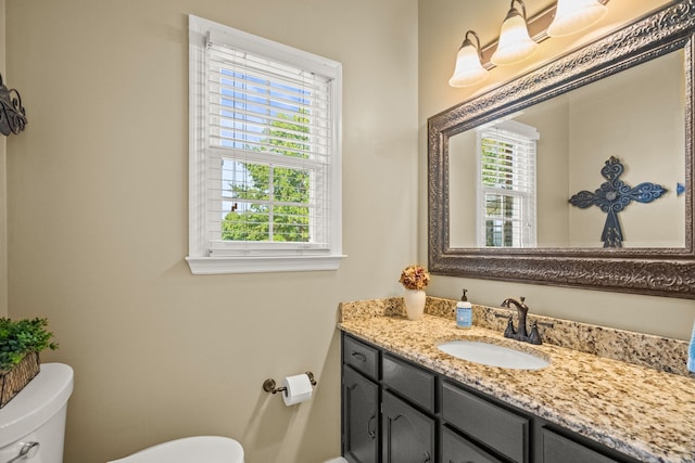 bathroom with vanity and toilet