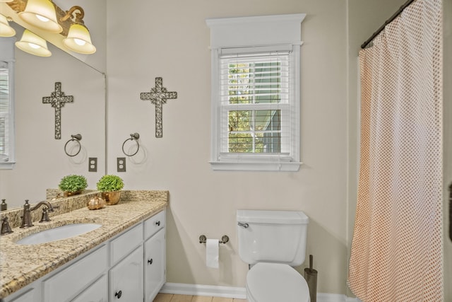 full bathroom with baseboards, toilet, a shower with curtain, tile patterned flooring, and vanity