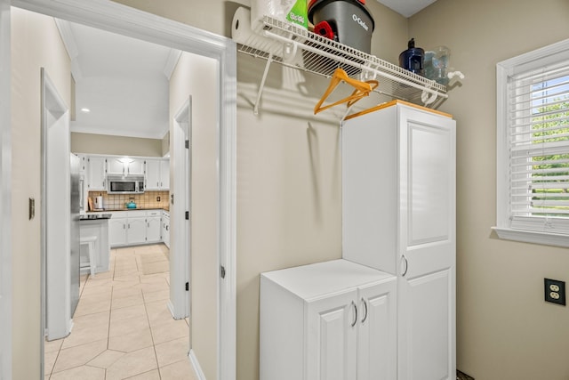 spacious closet with light tile patterned floors