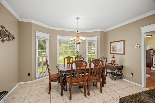 dining room featuring crown molding, light tile patterned floors, and an inviting chandelier