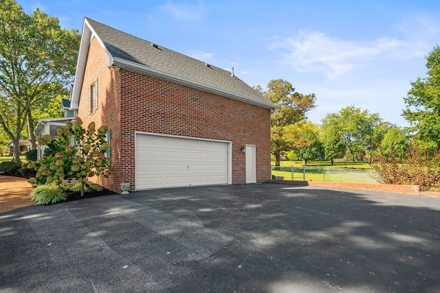 view of property exterior featuring a garage