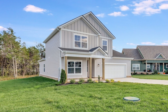 craftsman house with a garage and a front lawn