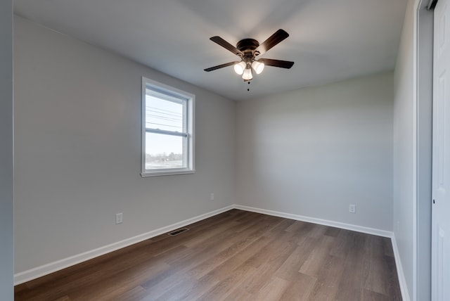 unfurnished room with ceiling fan and hardwood / wood-style floors