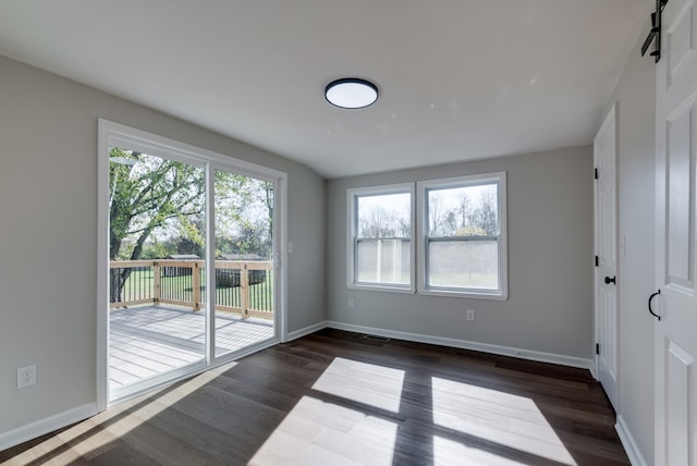 empty room featuring dark wood-type flooring