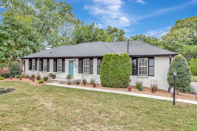 ranch-style house with a front yard