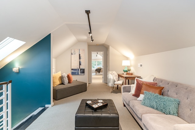 interior space featuring lofted ceiling with skylight