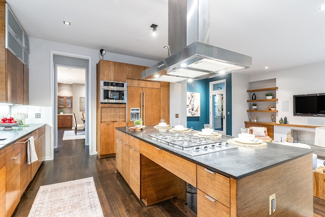 kitchen with dark hardwood / wood-style floors, a kitchen island, island exhaust hood, and stainless steel appliances