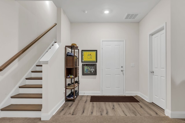 entrance foyer with light hardwood / wood-style floors