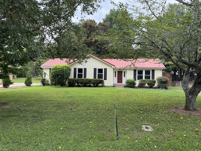 ranch-style home featuring a front yard