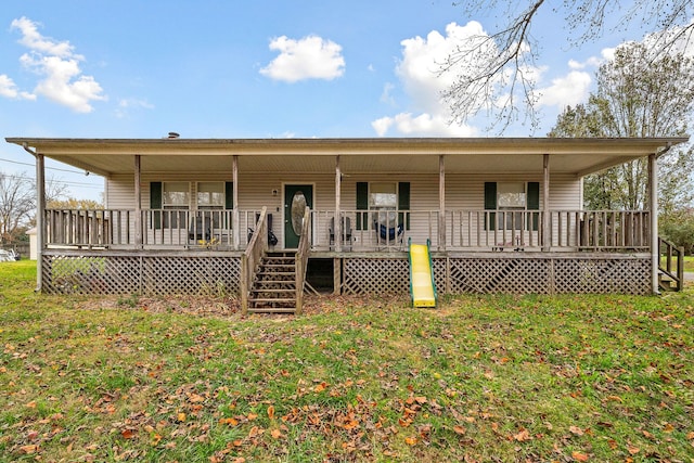 view of front of home featuring covered porch and a front yard