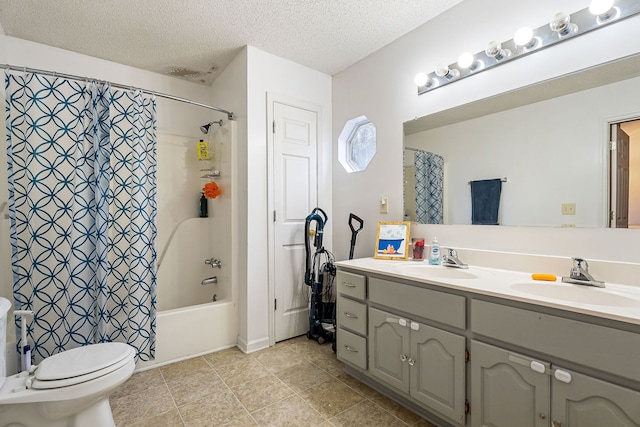 full bathroom with vanity, tile patterned floors, toilet, a textured ceiling, and shower / tub combo with curtain