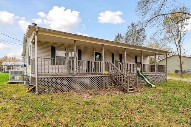 view of front of property with covered porch and a front yard