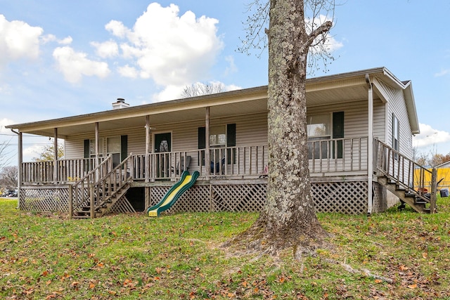 rear view of house with a porch