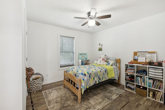 bedroom featuring ceiling fan and dark hardwood / wood-style floors