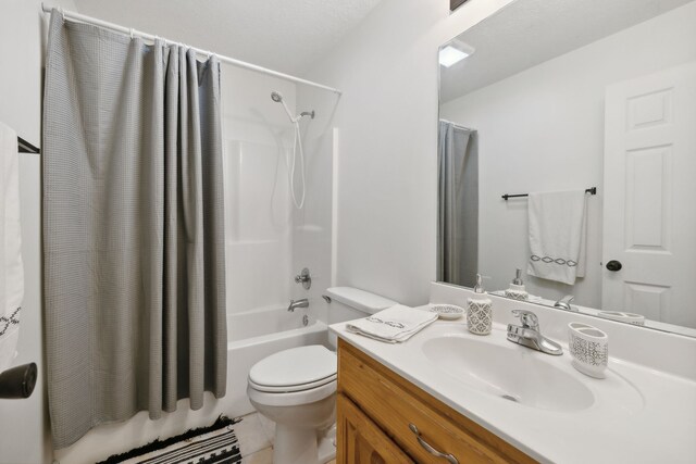 full bathroom with tile patterned flooring, vanity, shower / bath combination with curtain, and toilet