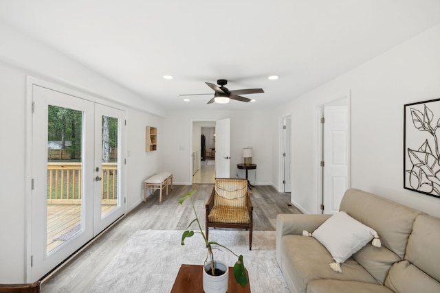 living room with ceiling fan, french doors, and hardwood / wood-style flooring