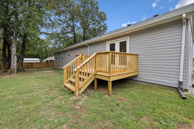 exterior space featuring a lawn and a wooden deck