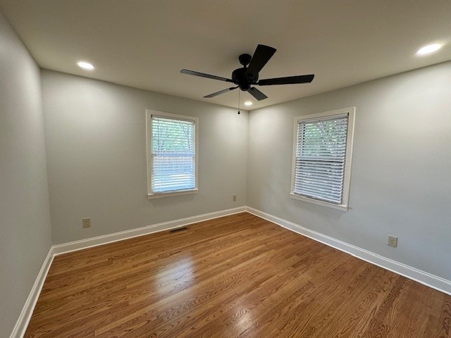 empty room featuring ceiling fan and wood-type flooring