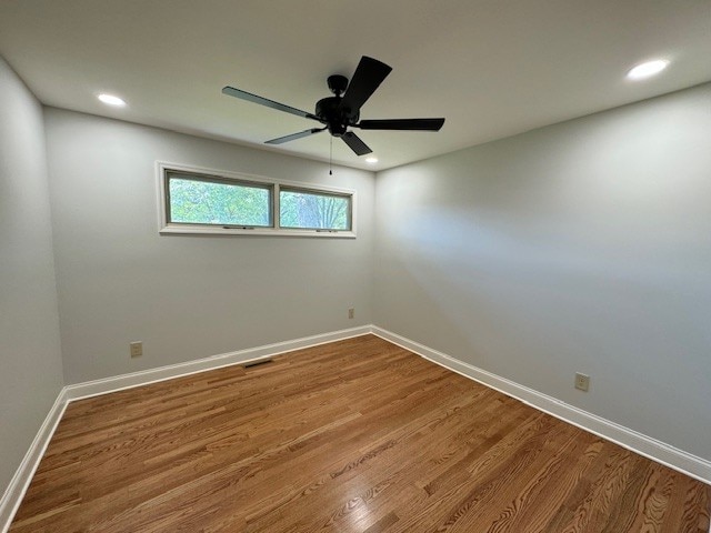 spare room featuring ceiling fan and wood-type flooring