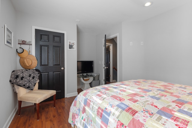 bedroom featuring dark hardwood / wood-style floors