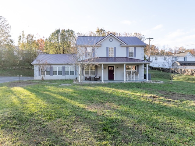 view of front of home with a porch and a front yard