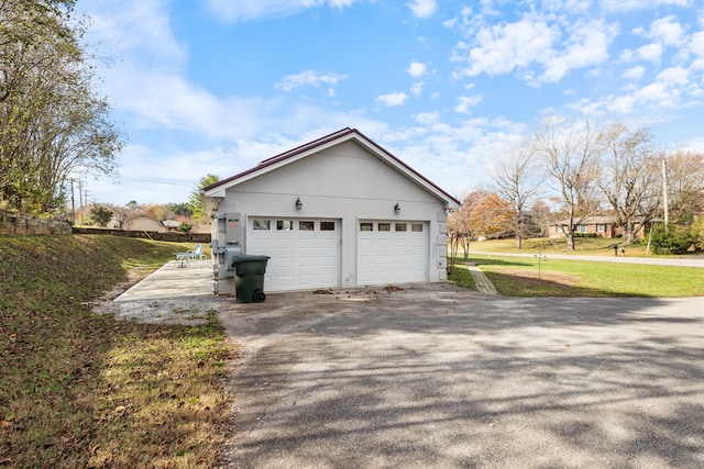 garage with a yard