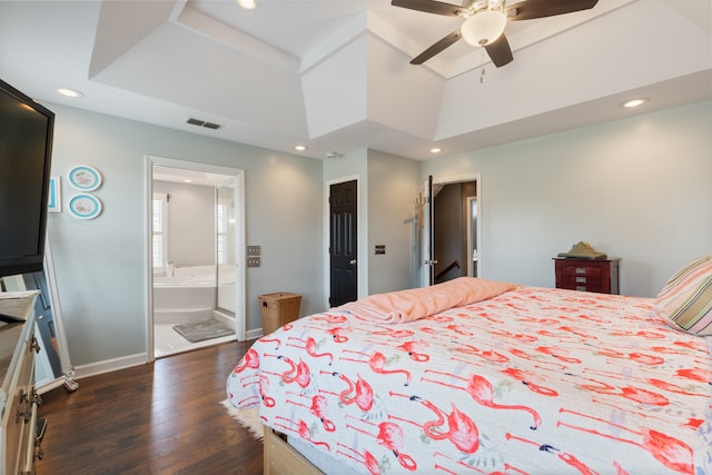 bedroom with ceiling fan, ensuite bathroom, and dark hardwood / wood-style floors