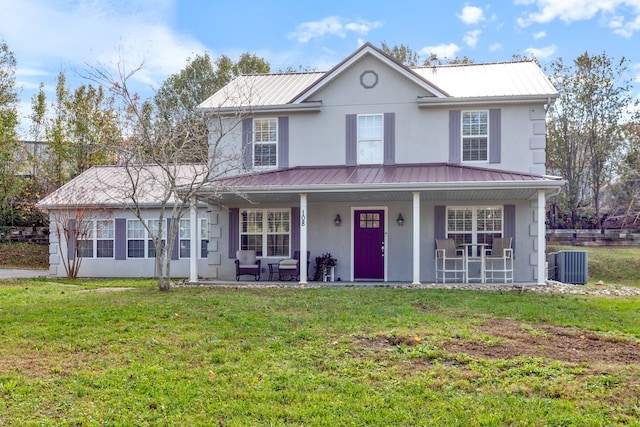 view of front of home featuring a front yard, a porch, and cooling unit