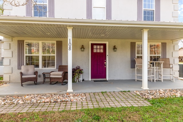 doorway to property featuring covered porch