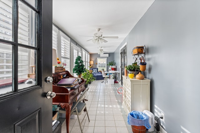 sunroom / solarium with ceiling fan