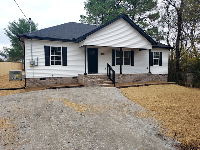 view of front facade with a porch and central air condition unit