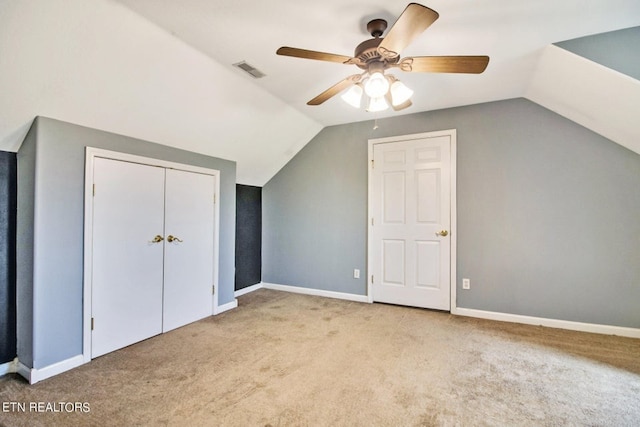 bonus room with light colored carpet, ceiling fan, and lofted ceiling