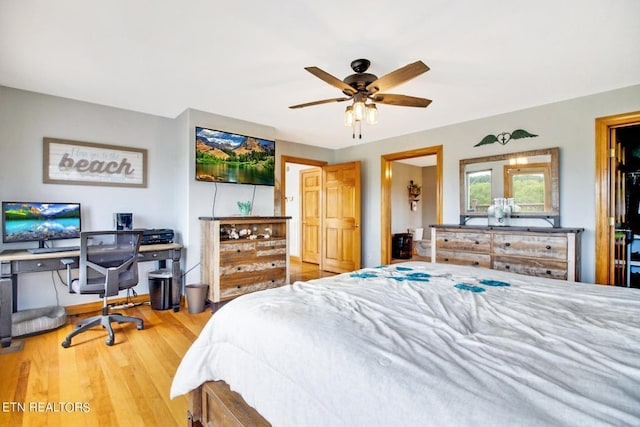 bedroom with hardwood / wood-style floors and ceiling fan