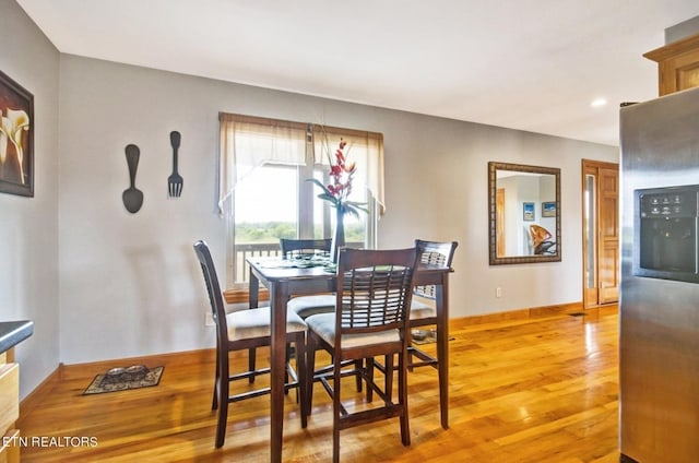 dining space featuring light hardwood / wood-style floors