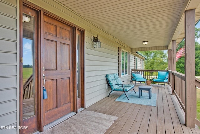 wooden terrace with a porch