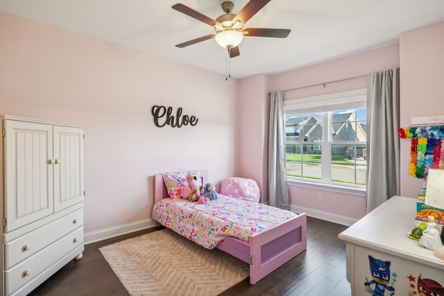 bedroom featuring ceiling fan and dark wood-type flooring