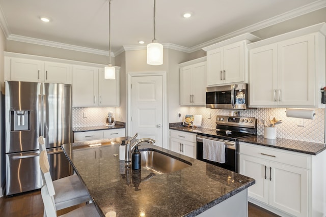 kitchen with white cabinetry, sink, backsplash, decorative light fixtures, and appliances with stainless steel finishes