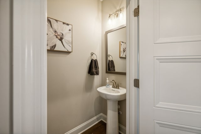 bathroom with hardwood / wood-style flooring