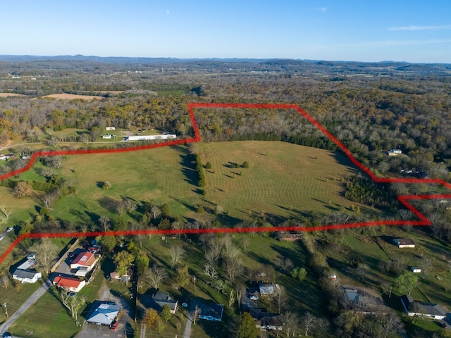 birds eye view of property featuring a rural view