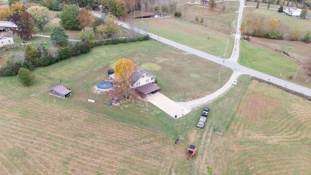 birds eye view of property featuring a rural view