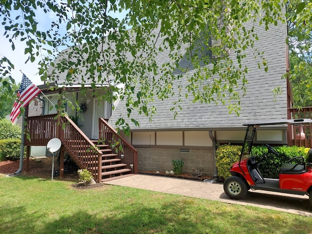 rear view of property with a yard