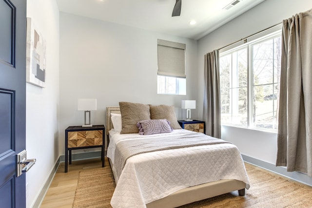 bedroom with light wood-type flooring and ceiling fan