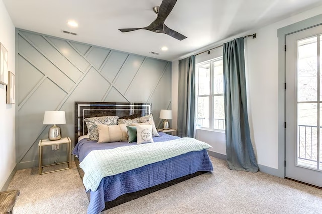 bedroom with light carpet, ceiling fan, and access to outside