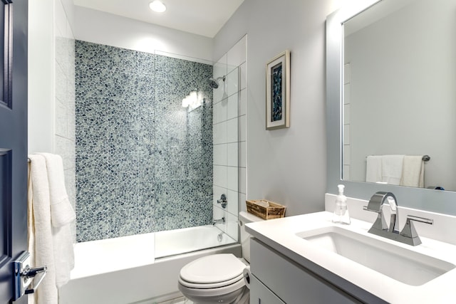 full bathroom featuring toilet, combined bath / shower with glass door, and vanity