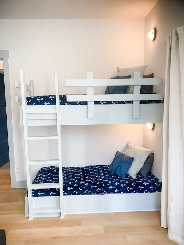 bedroom with hardwood / wood-style flooring