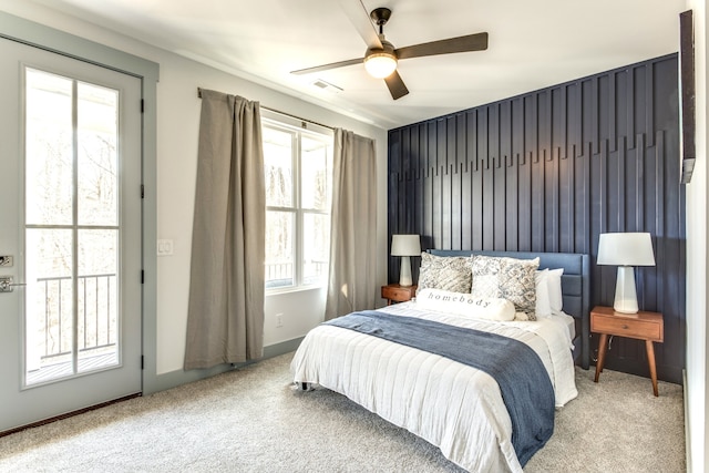 carpeted bedroom with access to exterior and ceiling fan