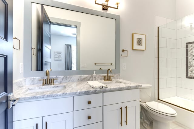 full bathroom with toilet, combined bath / shower with glass door, and vanity